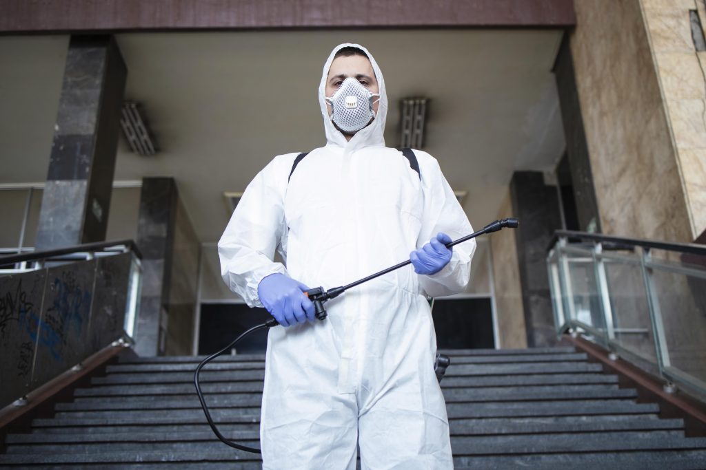 Pest control technician in protective gear in Dubai