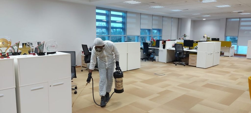 Pest control technician working inside a commercial facility in Dubai