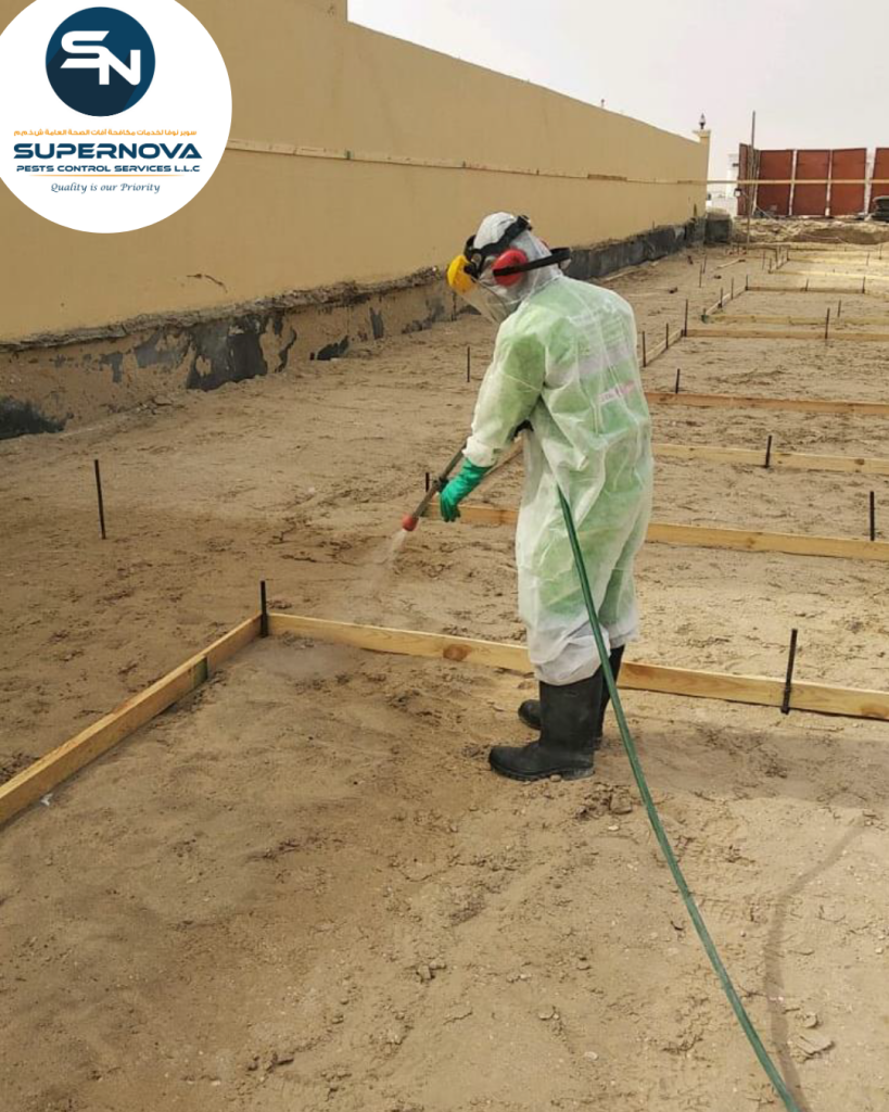 Professional technician applying pre-construction anti-termite treatment at a residential site in Dubai